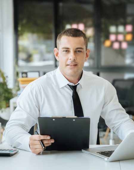 male-asian-sitting-at-the-desk-looking-to-camera-2024-12-19-17-03-16-utc (1)