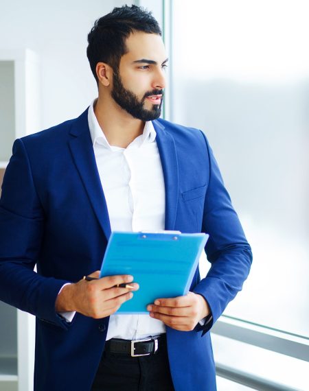 office-business-man-in-a-light-office-with-big-win-2025-02-12-23-00-50-utc (1)