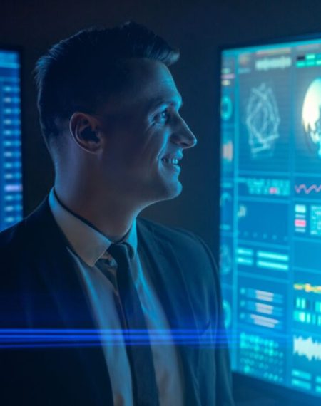 the-smiling-scientist-working-with-large-blue-moni-2024-12-04-02-20-07-utc-1-1024x683